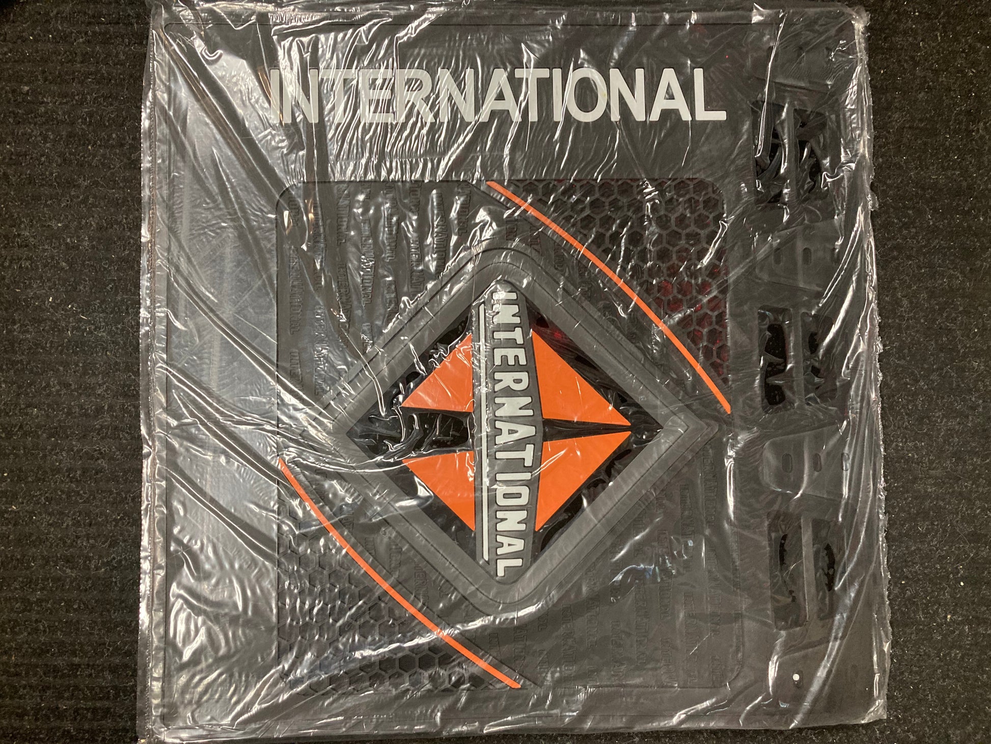 Black 24x24 International mud flap with side logo for heavy-duty trucks