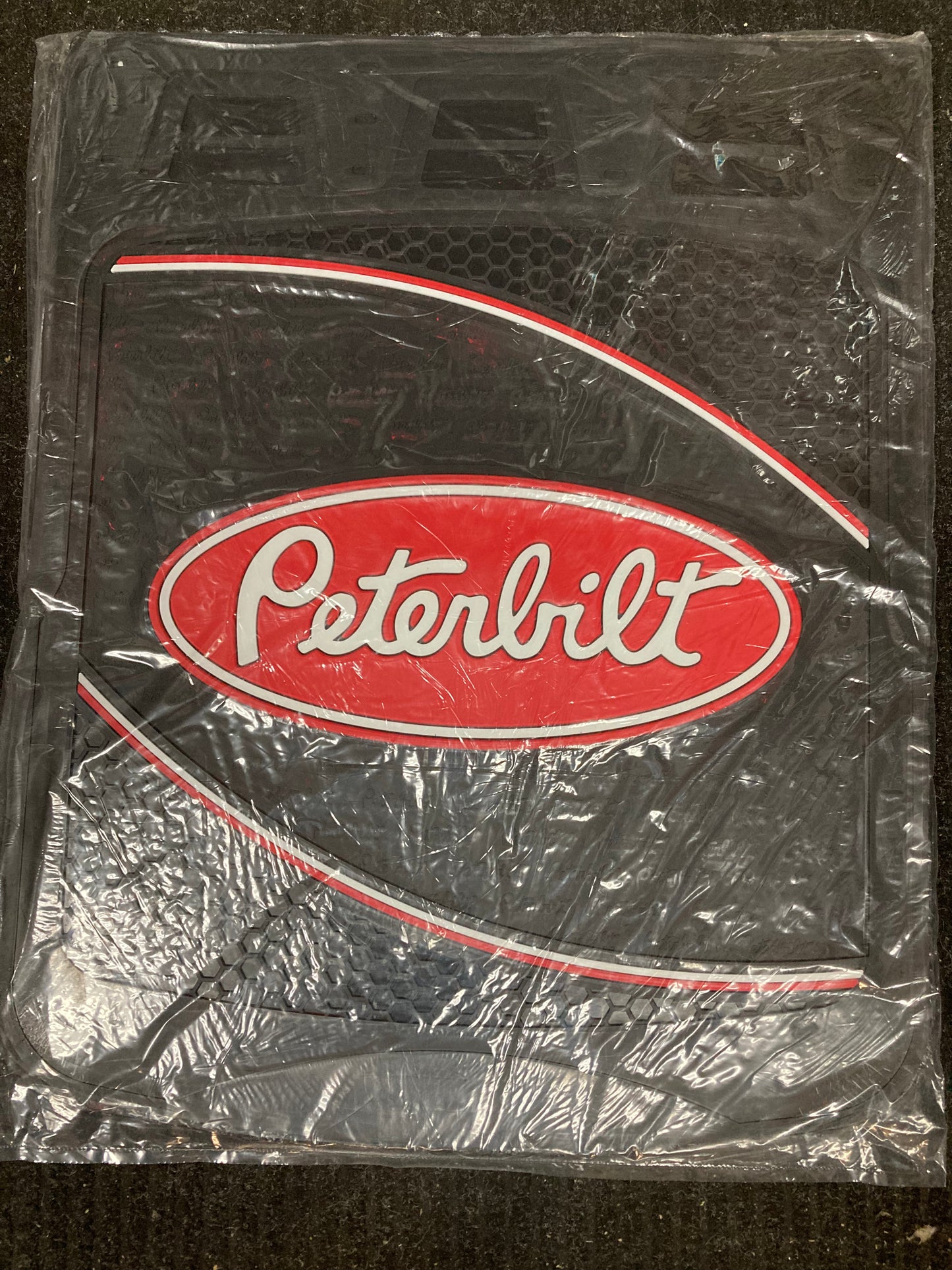 Black 24x30 Peterbilt mud flap with curve design and logo for heavy-duty trucks